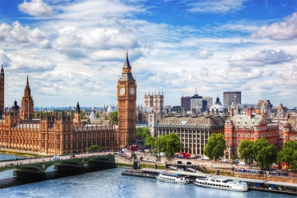 big ben westminster bridge on river thames in london the uk. english symbol. lovely puffy clouds sunny day min